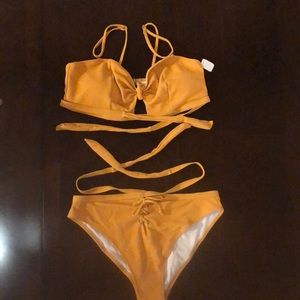 NWT. Sexy mustard colored bathing suit